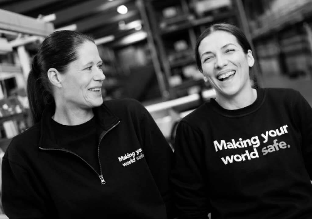 Two Troax employees smiling