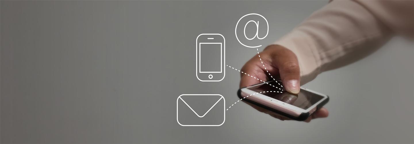 Hand with phone and contact symbols
