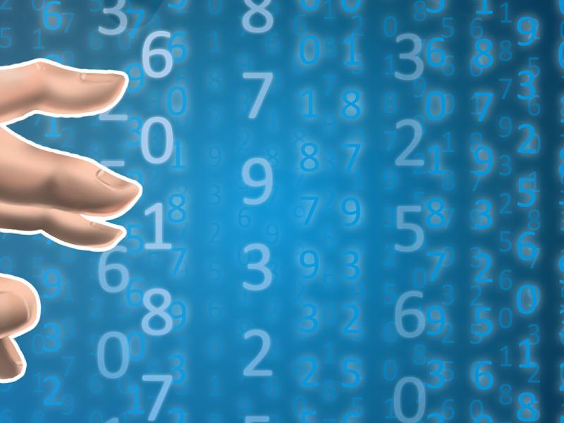 Hand in front of a digital background of numbers.